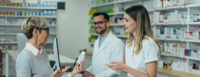 Antibiotics pharmacist-working-on-a-computer-while-female-pharmacist-is-giving-medications-to-senior-patient.jpg